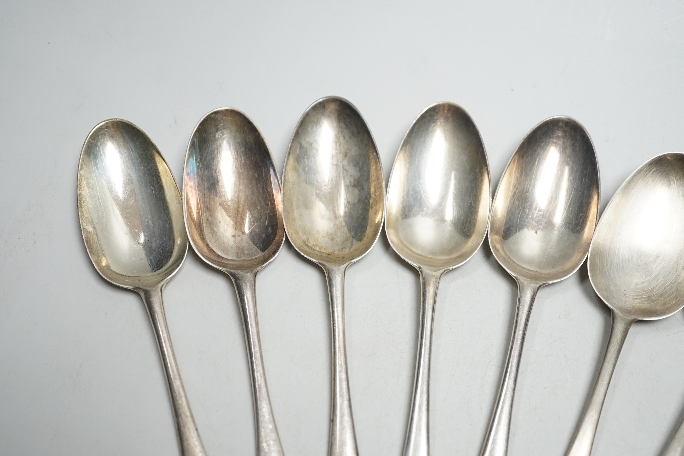 Nine George II silver Hanovarian? pattern tablespoons, eight by Elizabeth Oldfield, London, 1751, 20.7cm, 19.6oz, although some hallmarks are rubbed.